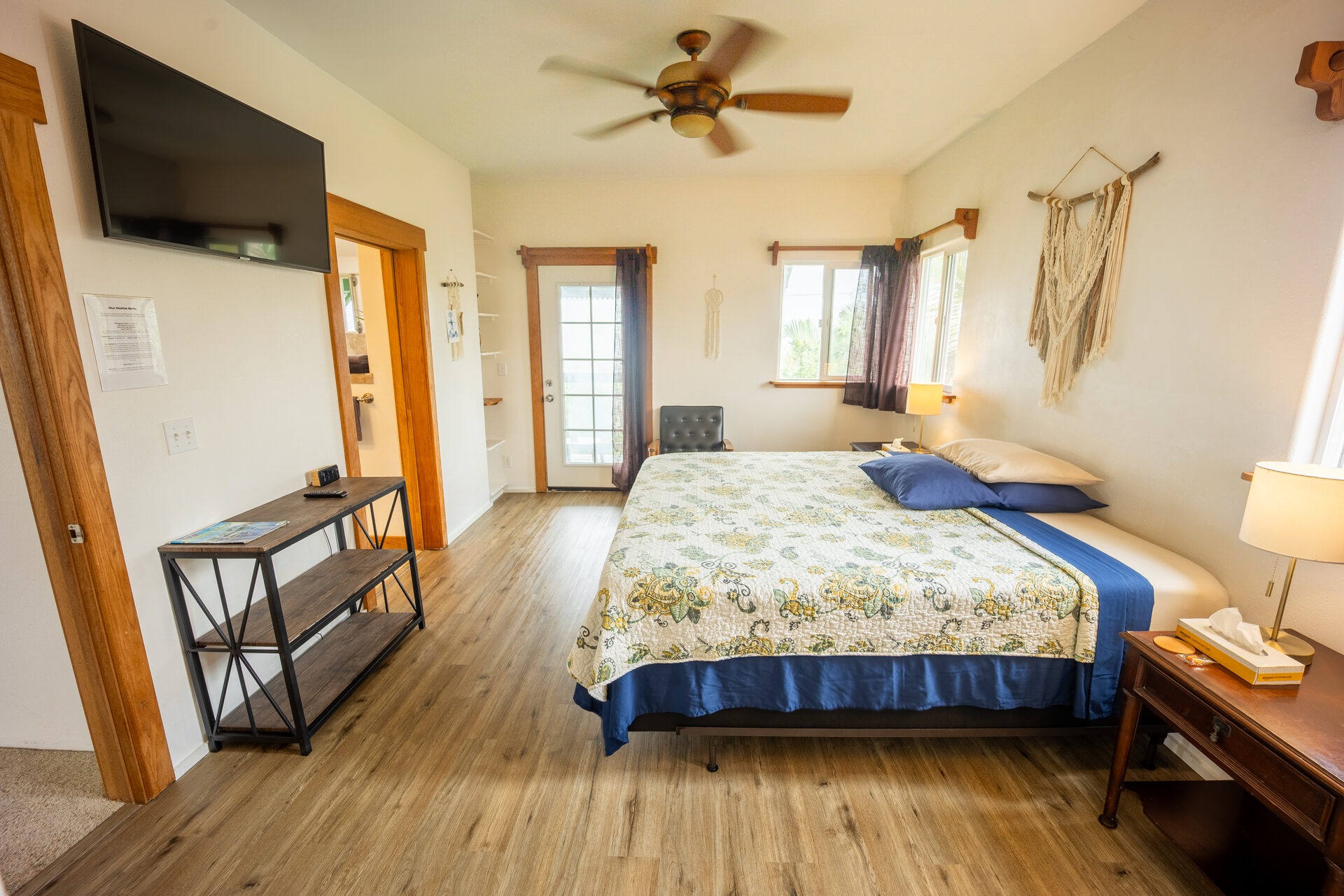 Lokelani Suite — bedroom with king bed and TV